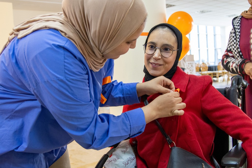 Moment of solidarity during the campaign against violence against women — orange ribbon