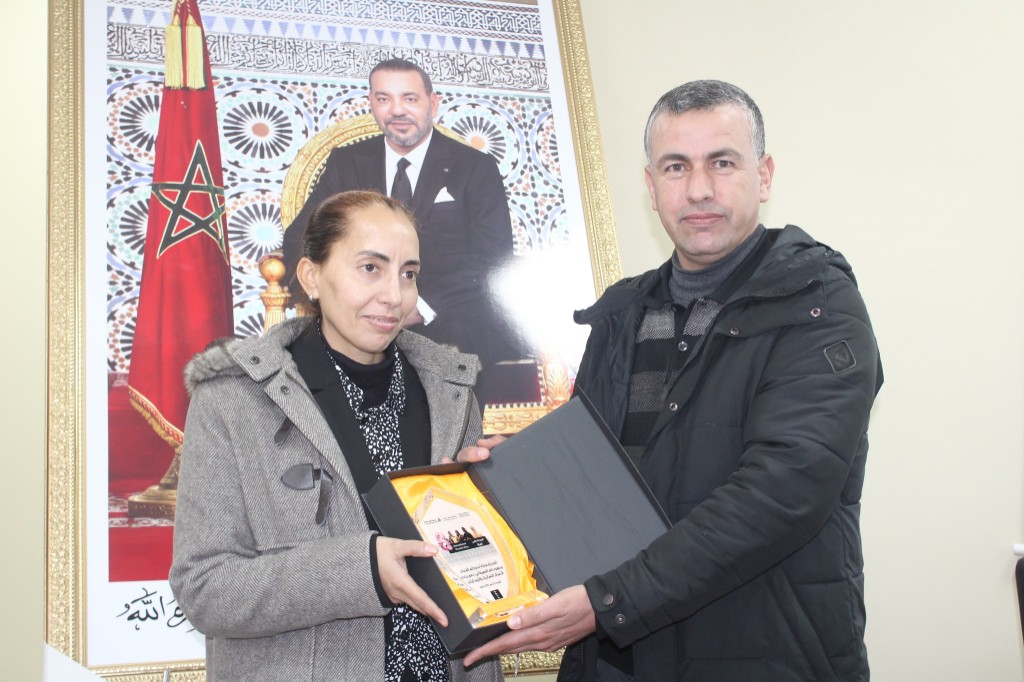 Award plaque presentation — International Women's Day 2025